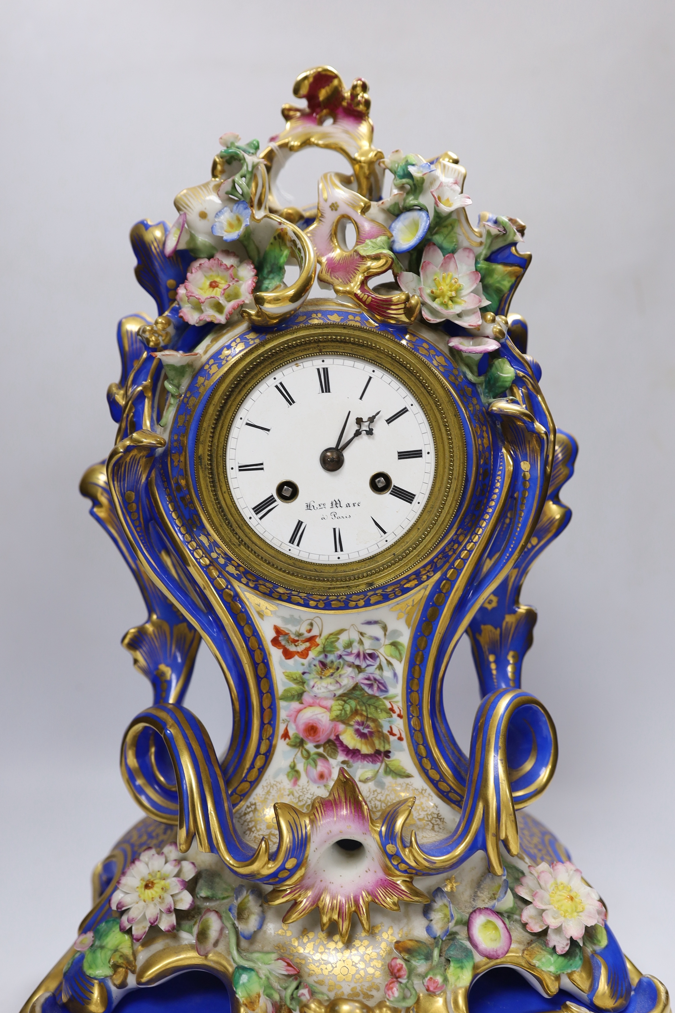 Henri Marc of Paris, a mid 19th century floral encrusted and painted balloon shaped eight day mantel clock, striking on a bell, with key, 42cm